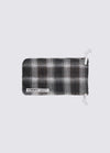 The A. SOCIETY x Universal Works Grey Aberdeen Sunglasses pouch. Grey and white plaid fabric with a drawstring closure. Shot on a white background.
