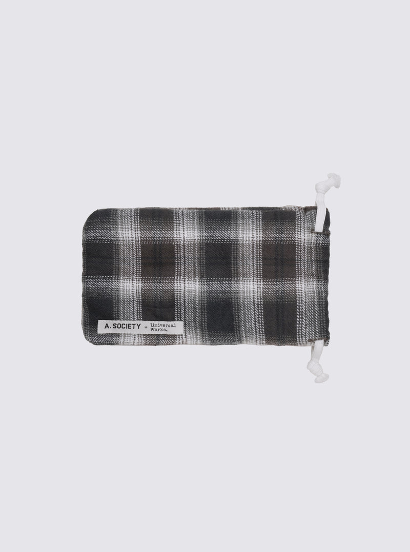A. SOCIETY x Universal Works Brown Stanley Sunglasses pouch. Brown and white plaid material with white drawstrings on a white background.