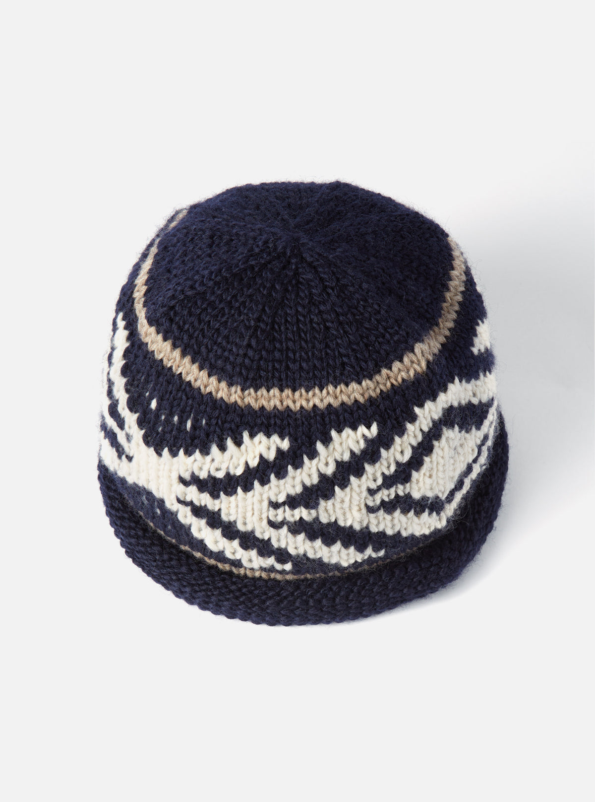 A studio product shot of the cableami® Navy Wool Jacquard Watch Cap on a plain white background, featuring a folded ribbed cuff, deep navy blue knitted wool fabric, and intricate jacquard pattern details.