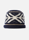 Close-up detail shot of the cableami® Navy Wool Jacquard Watch Cap on a plain white background, highlighting the intricate knit pattern, deep navy wool fabric, and textured turn-up cuff.