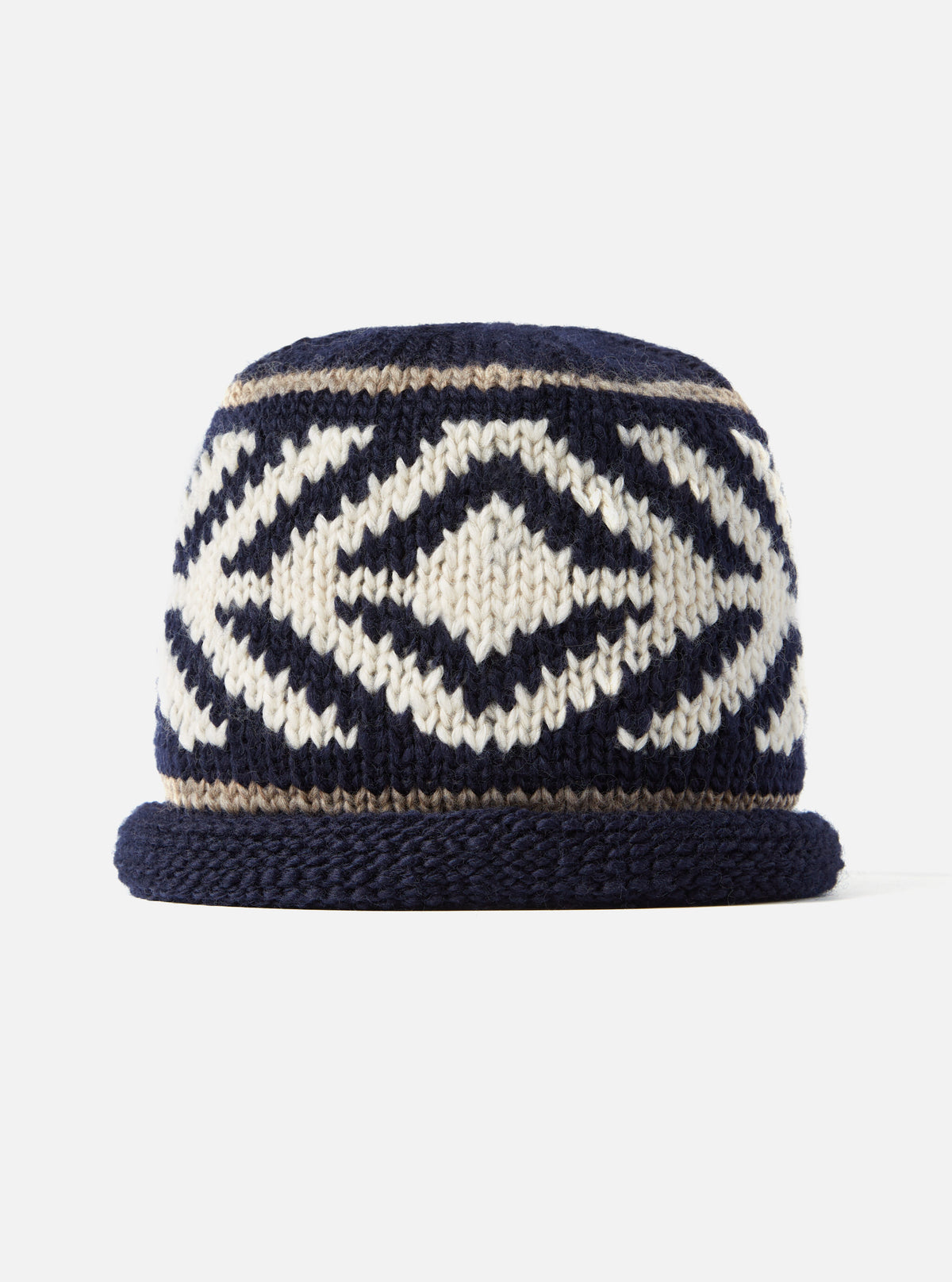 Detailed close-up view of the cableami® Navy Wool Jacquard Watch Cap laid flat on a plain white background, showcasing the jacquard pattern, crown shaping, and dark navy wool construction.