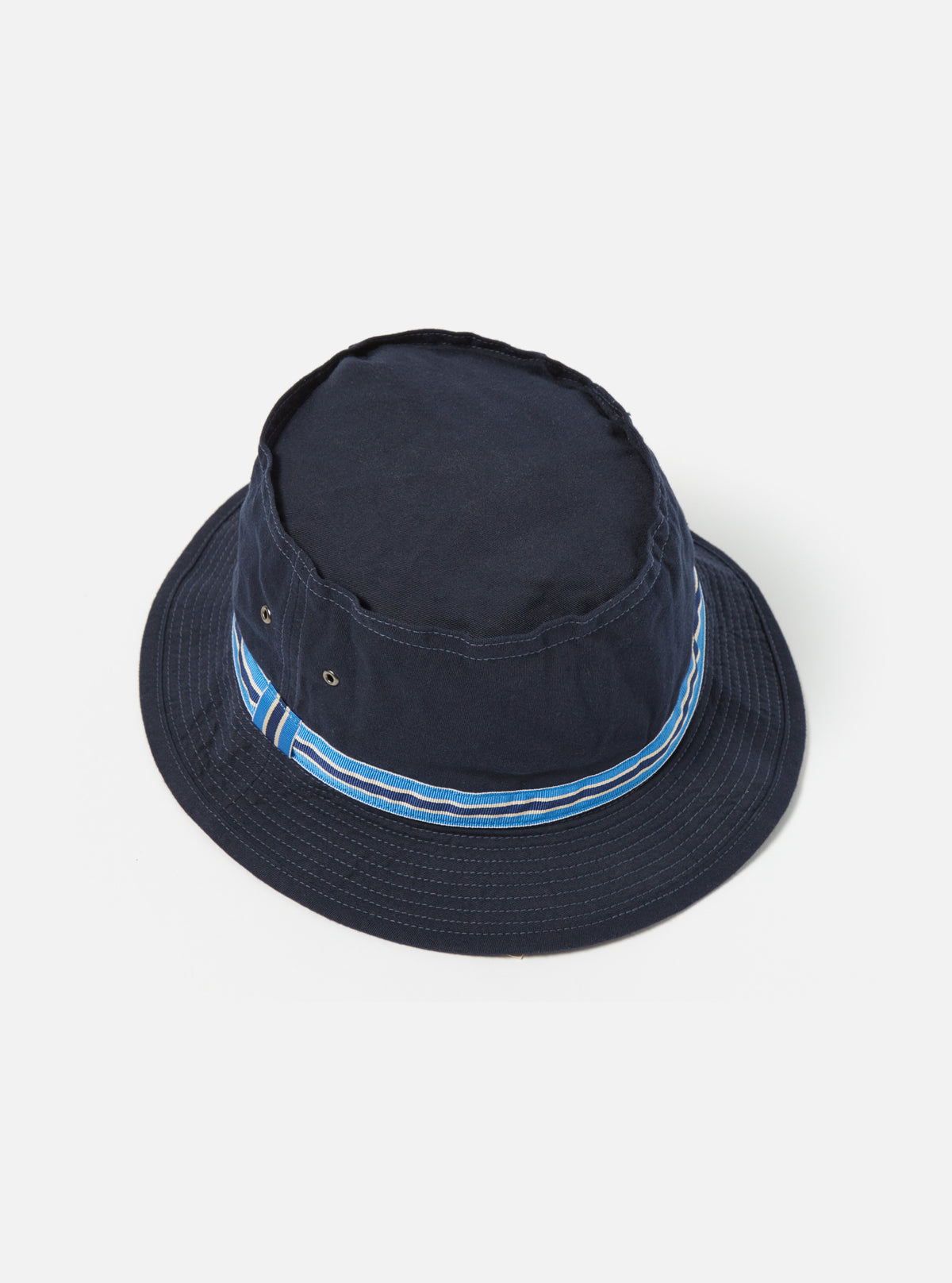 Isolated on white, the cableami® Navy Chino Cotton Loose Light Pork Pie Hat. The hat is navy with a blue and white striped band. Casual fit.