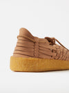 Close-up of the Malibu Walnut/Tan Vegan Leather/Crepe Latigo shoe on a white background. The shoe features a woven vegan leather upper and a crepe latigo sole.