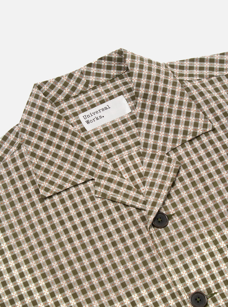 Close-up of the Olive Dobby Check Cancun Jacket on a white background. The jacket has an olive, white, and orange check pattern and dark buttons.