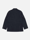 The back of a navy linen slub weave Manor Jacket on a white background. The jacket has a classic fit and visible seams.