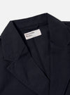 Close-up of the Navy Linen Slub Weave Manor Jacket on a white background, showcasing the texture and cut. The jacket's label is visible.