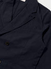 Close-up of the Navy Linen Slub Weave Manor Jacket on a white background. The jacket is navy blue with brown buttons and a classic fit.