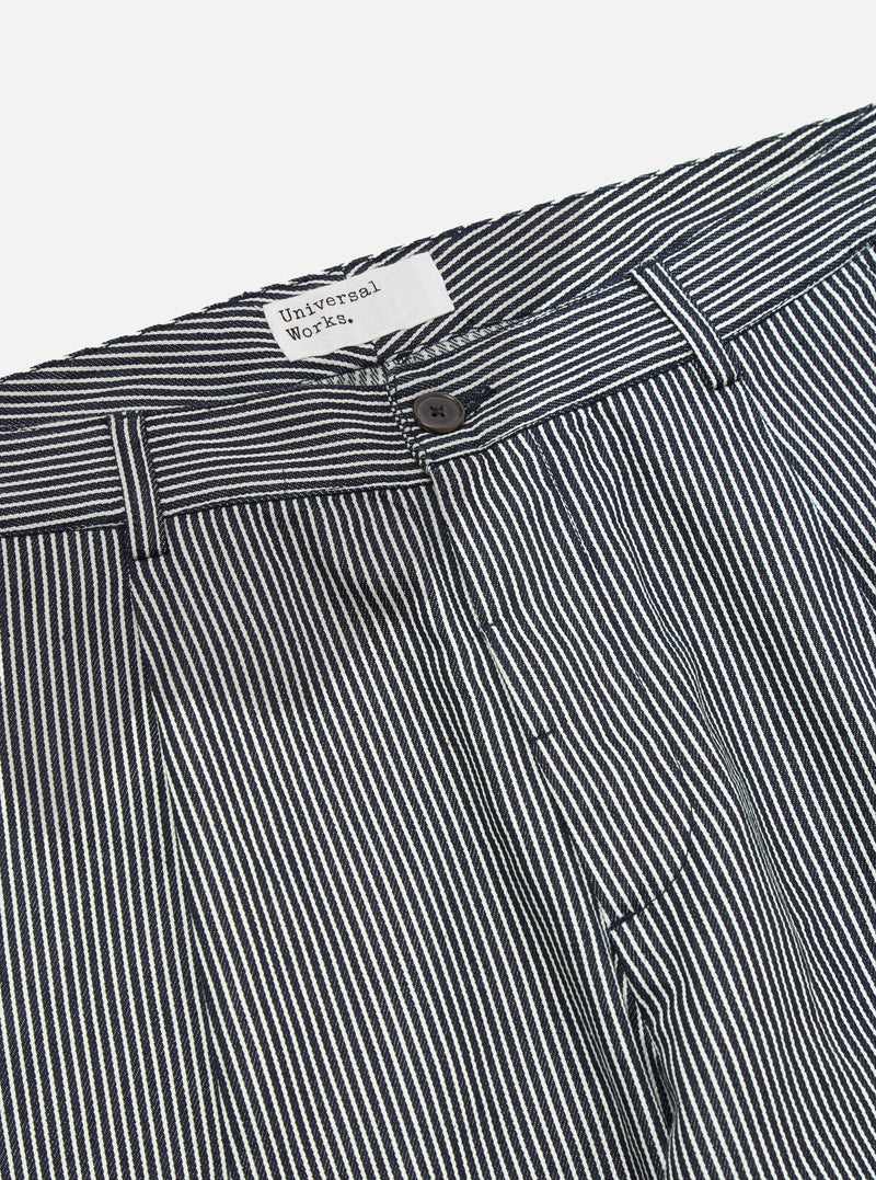 Close-up of the Indigo Hickory Stripe Denim Duke Pant. The denim is indigo with white stripes. The pants are on a white background.
