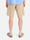 Back view of a model wearing the Sand Military Cotton Simple Short. The cotton shorts are paired with a blue shirt and sandals, set against a clean white background.