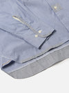 Close-up of the Mixed Blue Mixed Classics Patched Lazy Day Shirt on a white surface. Shows the sleeve, buttons, and patched details of the blue fabric shirt.