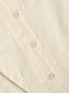Close-up of the Ecru Linen Cotton Shirting Travail Overshirt, showcasing the light ecru color, linen-cotton blend texture, button details, and tailored fit. Shot on a plain, light background.
