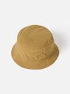 The Dark Sand Peach Recycled Nylon Beach Hat is displayed on a white background. The hat is a light brown color and made of a smooth, slightly shiny material.