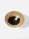 Inside view of the Dark Sand Peach Recycled Nylon Beach Hat on a white background. The hat has a black mesh lining and a fabric tag.