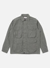The Charcoal Organic Chambray Parachute Field Jacket is laid flat on a white background. The jacket is a light charcoal color and has four front pockets.