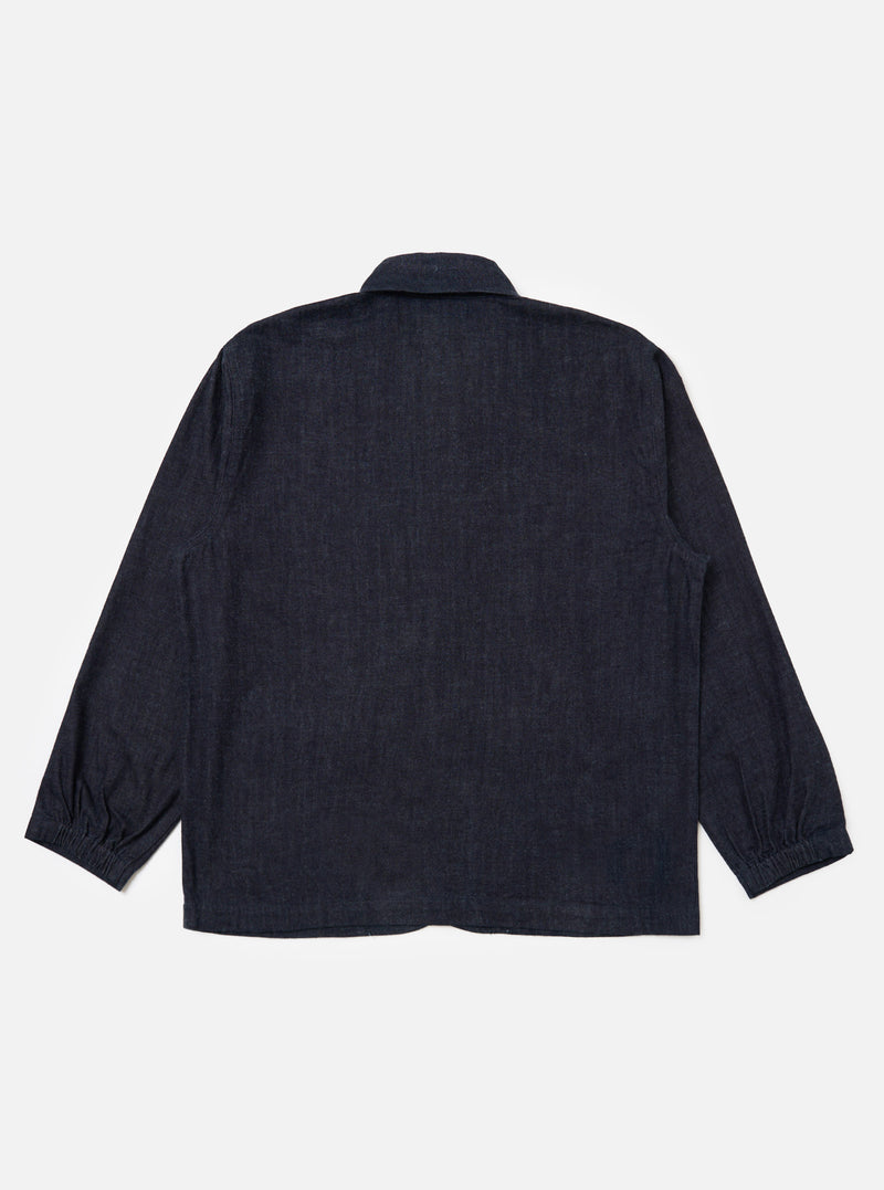 Back view of the Indigo Brushed Denim Labour Jacket on a white background. The jacket is a dark indigo color and has long sleeves with elasticated cuffs.