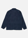 Back view of the Dark Navy Patchwork Weave Cotton Labour Jacket on a white background. The jacket features a subtle patchwork design and a classic collar.