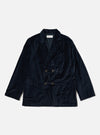 The Navy Velveteen Manor Jacket is displayed on a white background. The jacket is a rich navy color and made of soft velveteen material. It has a relaxed fit and features a double-breasted closure.