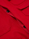 Close-up of the Embroidered Red Mowbray Military Fatigue Jacket. The red wool jacket has black buttons and a red lining. The image is shot in a studio.