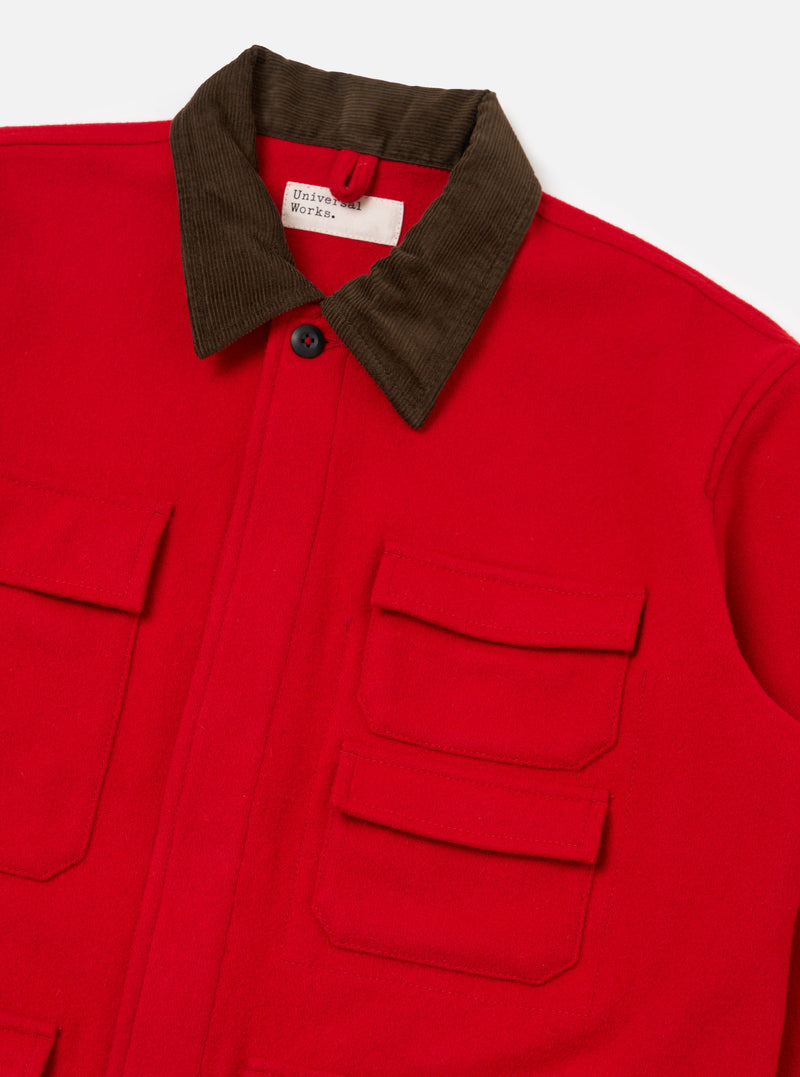Close up of the Red Mowbray Military Fatigue Jacket on a white background. The jacket is red with a brown corduroy collar and multiple pockets.