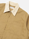 Close-up of the Khaki Works Twill Rose Bowl Jacket on a white background. The jacket is khaki with a cream-colored collar and a front zipper. A pocket is visible on the left side.