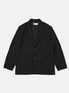 The Black Organic Canvas Two Button Jacket is laid flat on a white background. The jacket is a dark black color and has two pockets on either side.