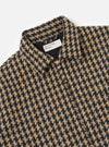 Close-up of the Sand Cortina Tweed Windcheater. The jacket features a brown and black tweed pattern and a silver zipper on a white background.