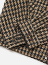 Close-up of the Sand Cortina Tweed Windcheater showing the tweed fabric, buttoned cuffs, and zipper on a white background.