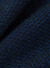 Close-up of the Black/Indigo Denim Camo 4 Pocket Gilet fabric. The denim has a subtle camo pattern in black and indigo. The texture of the fabric is visible.