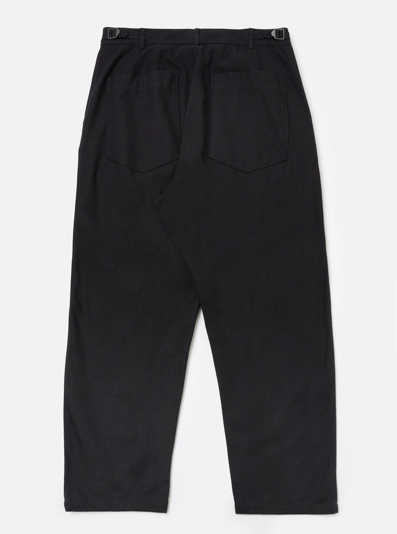 Back view of Black Organic Canvas Dutch Pant on a white background. The pants are wide-legged with belt loops and back pockets.