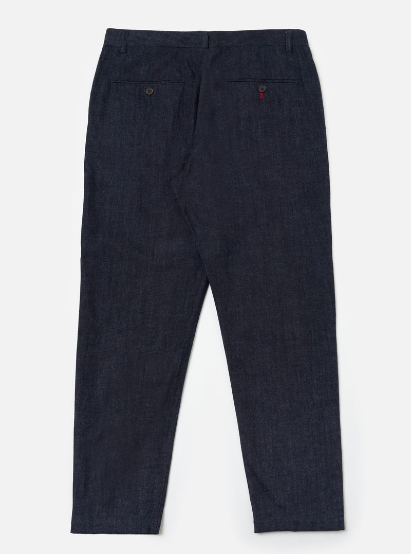 Back view of Indigo Brushed Denim Military Chino on a white background. The dark wash denim pants have a classic fit.