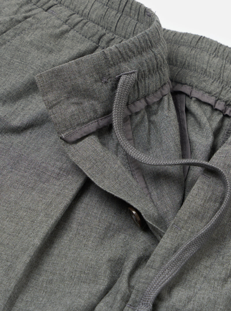 Close-up of the Charcoal Organic Chambray Oxford Pant, showcasing the organic chambray material, elastic waistband with drawstring, and button closure on a white background.