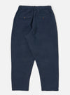Dark navy patchwork weave cotton pleated track pant laid flat on a white background. The pants have an elastic waistband and two back pockets.