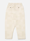 Back view of Ecru Patchwork Weave Cotton Pleated Track Pant on a white background. The pants have a relaxed fit and feature a unique patchwork design.