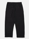 The Black Organic Canvas Super Chino laid flat on a white background. The chinos are black canvas with a relaxed fit and cuffed hems.