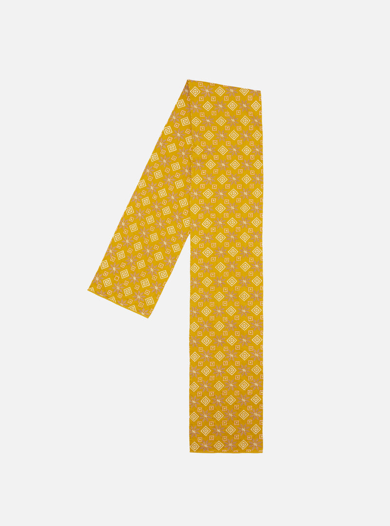Flat lay of a Mustard Embroidery Cotton Satin Embroidery Scarf on a white background. The scarf features a geometric pattern in mustard, white, and brown.