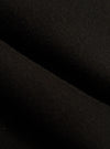Close-up of the Black Brush Back Sweat Tyler Sweat Jacket fabric. The soft, brushed texture is visible in the dark material.