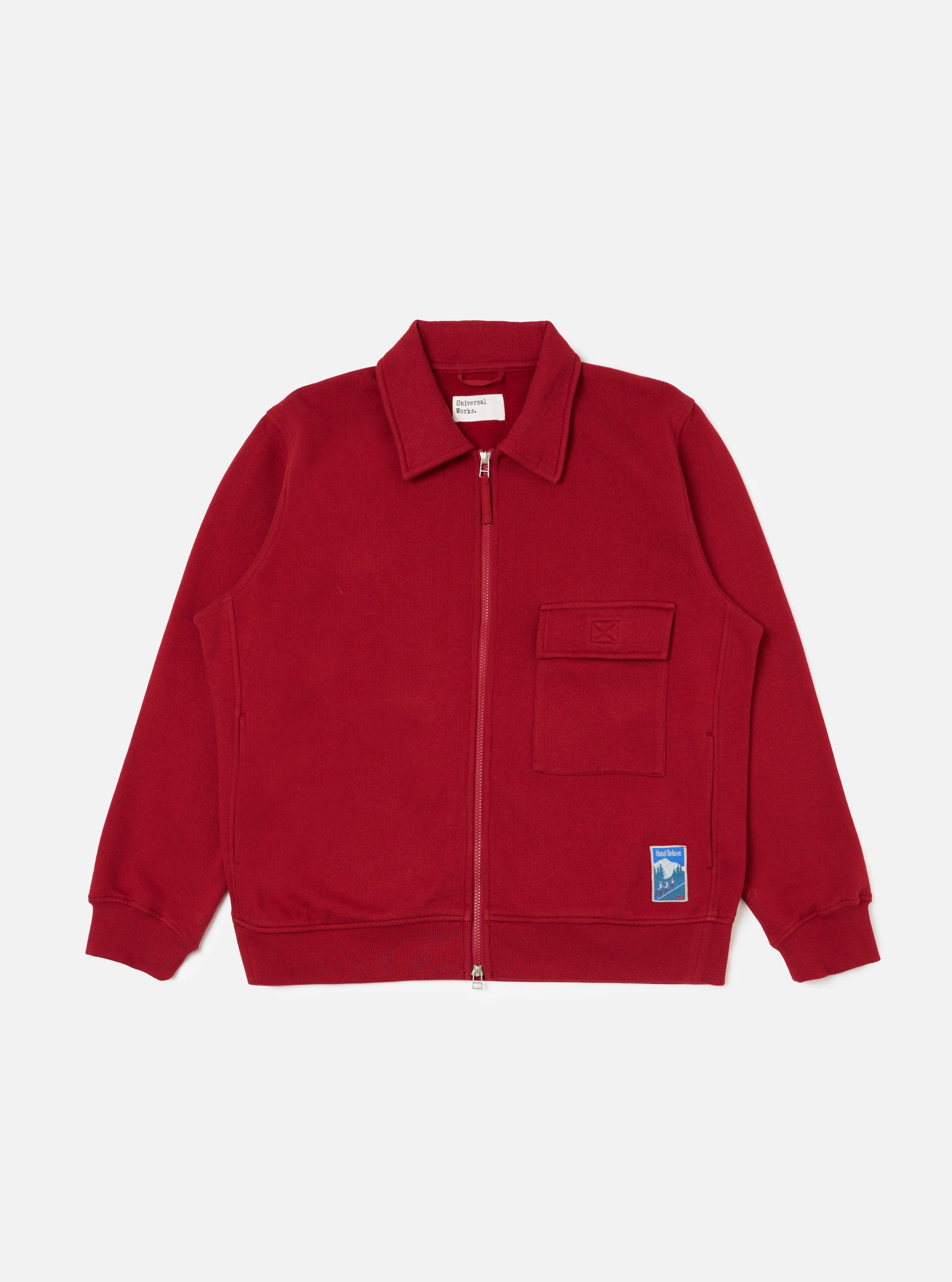 The Red Brush Back Sweat Tyler Sweat Jacket is displayed on a white background. The jacket is a vibrant red and features a collared neck and zip-up front.