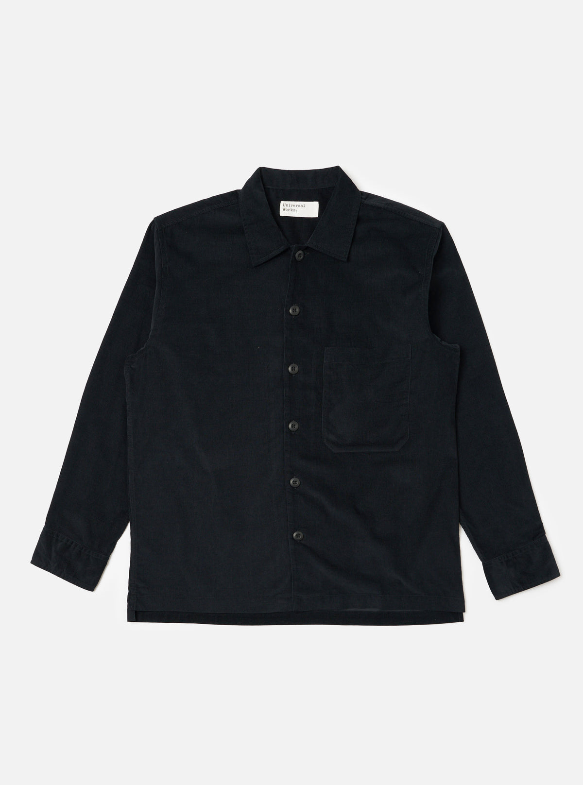 The Black Organic Fine Cord Fatigue Shirt is laid flat on a white background. The shirt is a dark color and made of corduroy. It has long sleeves and a button-up front.