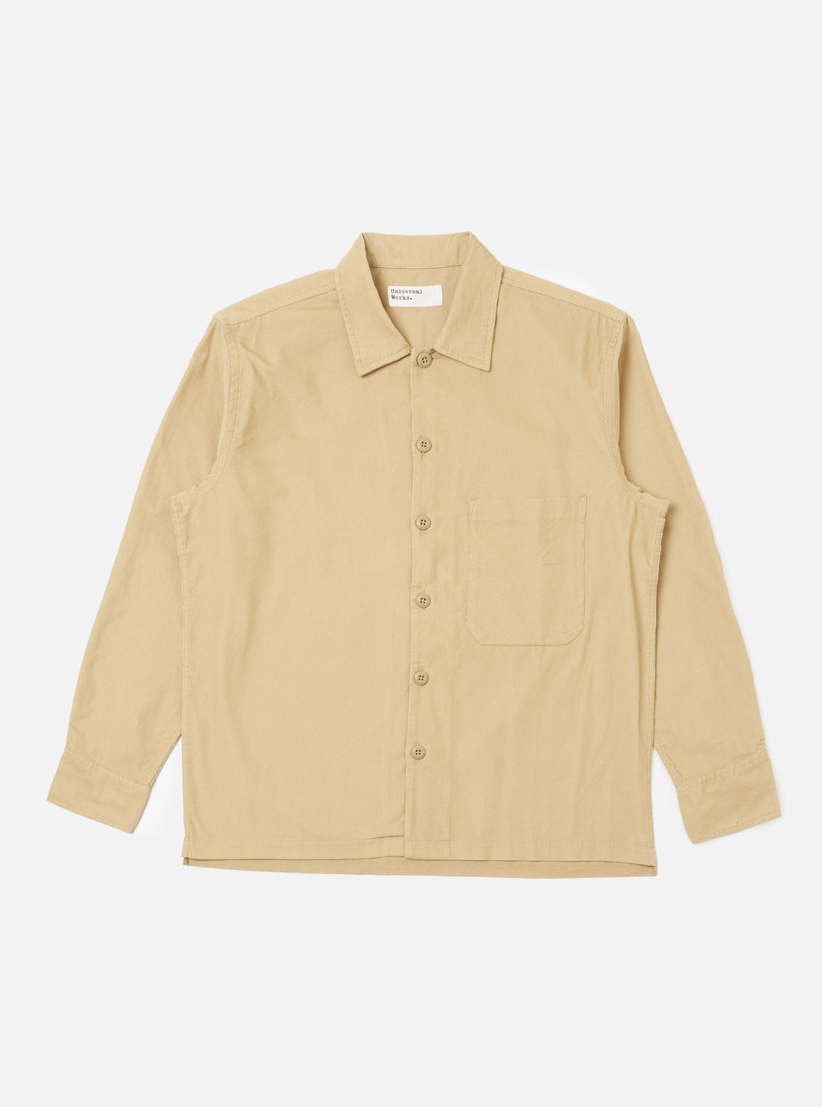 The Sand Organic Fine Cord Fatigue Shirt, laid flat on a white background. The shirt is a light tan color and made of fine corduroy. It has long sleeves, a button-down front, and a chest pocket.