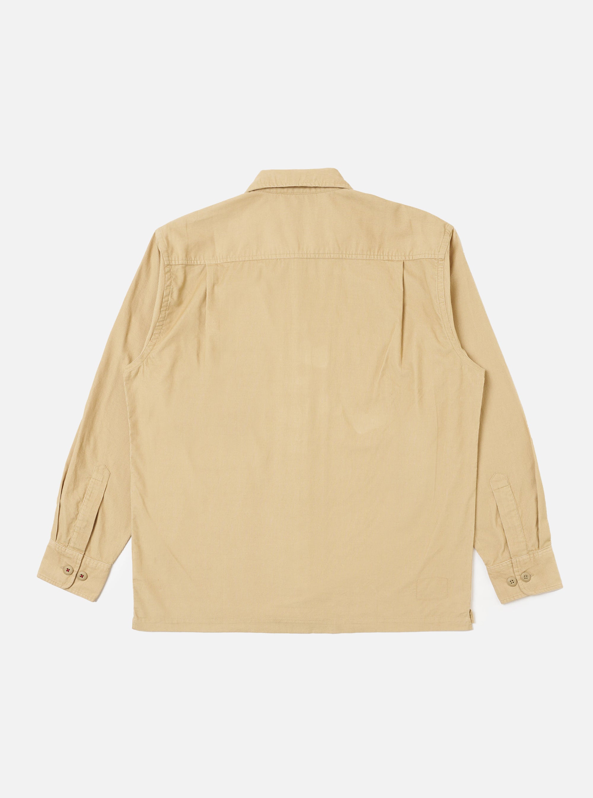 Back view of the Sand Organic Fine Cord Fatigue Shirt on a white background. The shirt is a light tan color and made of fine cord material. It has long sleeves and a button-down front.