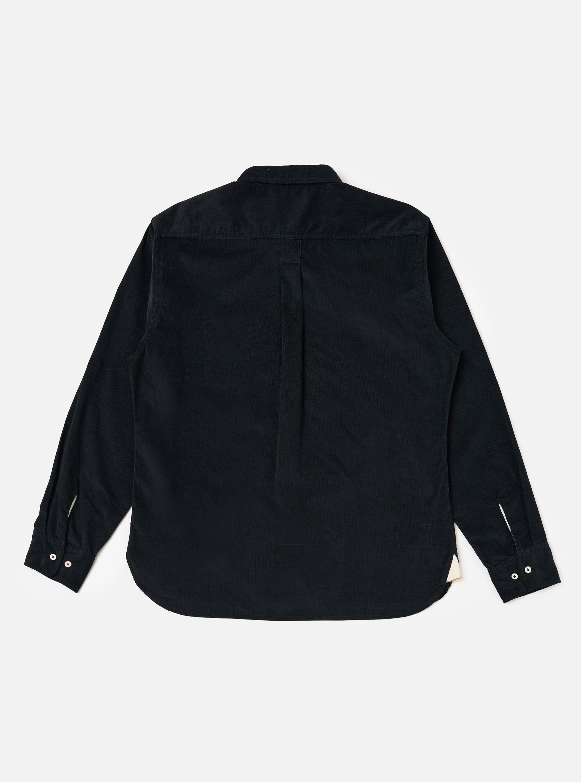 Back view of the Black Organic Fine Cord Daybrook Shirt, laid flat on a white background. The shirt is dark, long-sleeved, and made of fine corduroy.