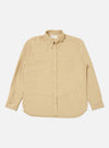 The Sand Organic Fine Cord Daybrook Shirt, a long-sleeved button-down, is laid flat on a white background. The shirt is a light tan color and appears to be made of corduroy.