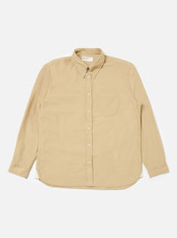 The Sand Organic Fine Cord Daybrook Shirt, a long-sleeved button-down, is laid flat on a white background. The shirt is a light tan color and appears to be made of corduroy.