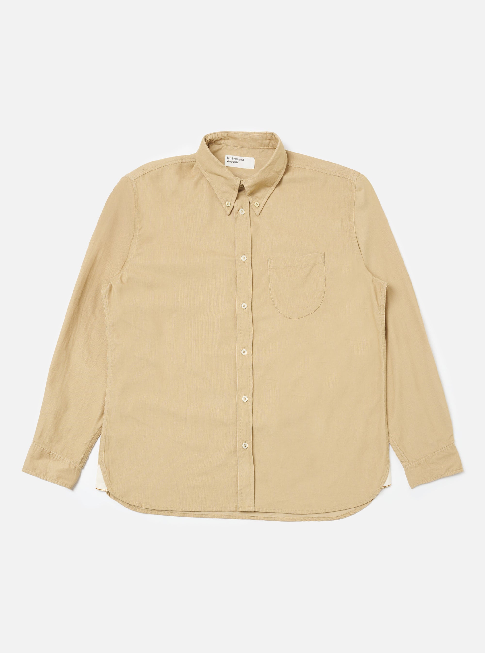 The Sand Organic Fine Cord Daybrook Shirt, a long-sleeved button-down, is laid flat on a white background. The shirt is a light tan color and appears to be made of corduroy.