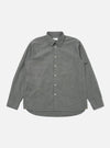 The Charcoal Organic Chambray Patched Lazy Day Shirt is laid flat on a white background. The long-sleeved shirt is charcoal gray with white buttons and a chest pocket.