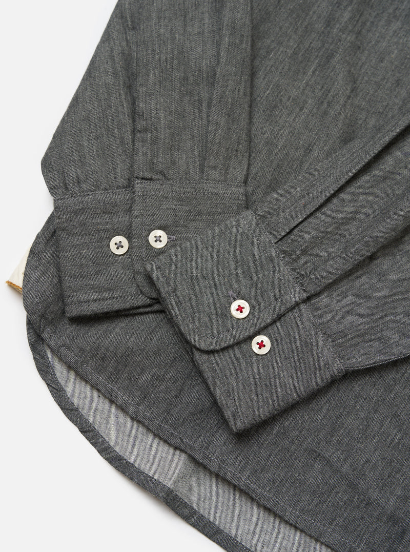 Close-up of the Charcoal Brushed Organic Cotton Square Pocket Shirt showing the cuff, buttons, and hem on a white background.