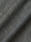 Close-up of the Charcoal Brushed Organic Cotton Square Pocket Shirt fabric. The charcoal material is folded to show texture.