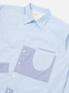 Close-up of the Blue Office Stripe Patched Lazy Day Shirt on a white background. The shirt features blue and white stripes with light blue patched pockets.