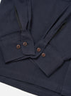Close-up of the Dark Navy Sid Flannel CPO Shirt on a white surface. Shows the flannel texture, button details, and sleeve construction.