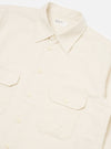 Close-up of the Ecru Sid Flannel CPO Shirt on a white background. The shirt is ecru-colored and made of flannel. It has a classic fit with a button-down front and two chest pockets.